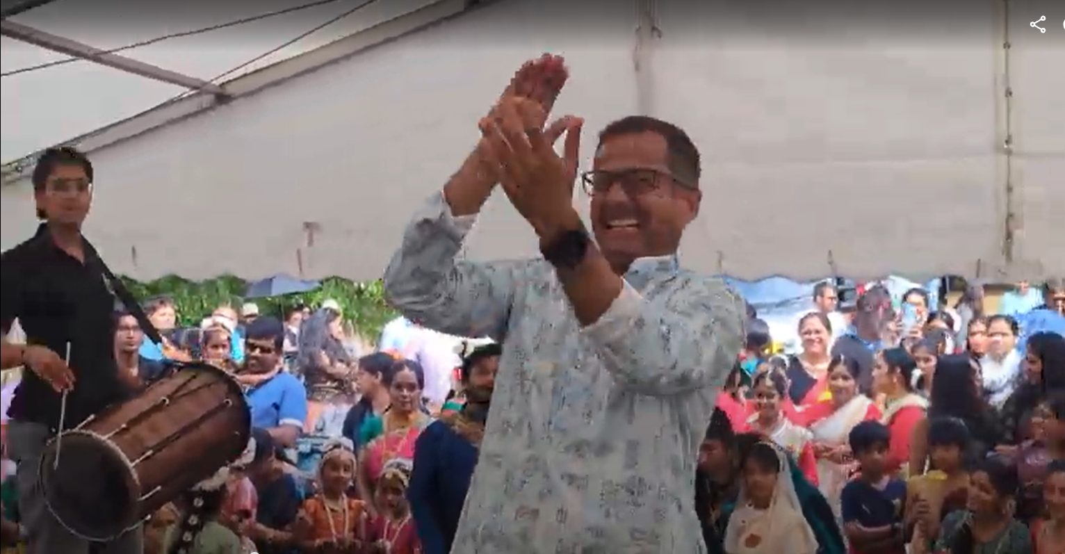 Performer with India and UK flags